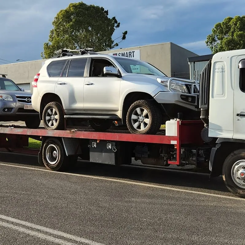 A four wheel drive loaded onto the tilt tray for free removal